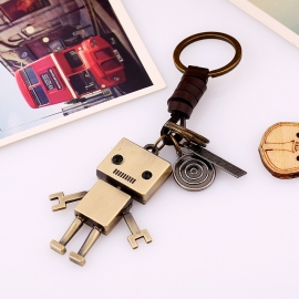 Hand-woven cowhide key chain movable alloy robot creative leather key chain wholesale backpack pendant